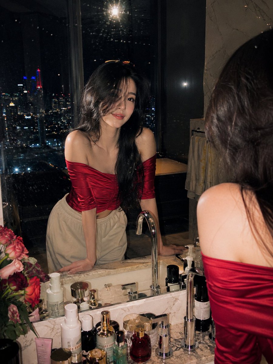 Cinematic Night Portrait Photography of a Beautiful Young Woman Standing At a Luxury Marble Bathroom