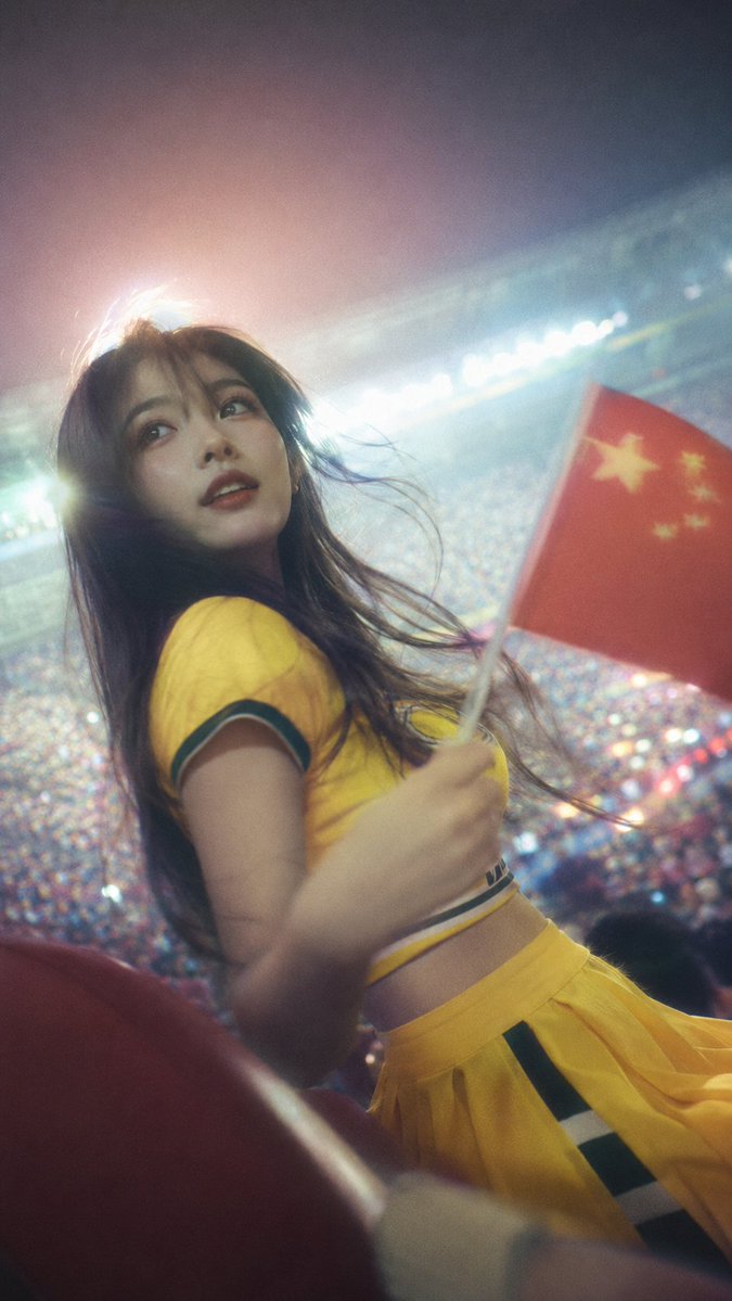Vertical Photo of One Energetic Young Adult Female Football Fan/cheerleader in a Packed Stadium